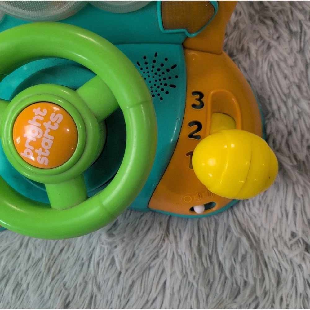 Bright Starts Lights & Colors Driver Light-Up Musical Baby Activity Toy Works